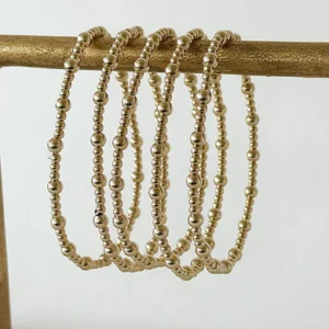 Bracelet with 14 k gold in 2 sized beads